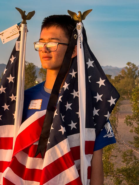 Two women, mothers of fallen soldiers, stand side-by side, holding American flags that represent their fallen sons. An image gallery from that morning shows pictures of fallen soldiers, runners along the Papago Park trail and a beautiful desert morning.
