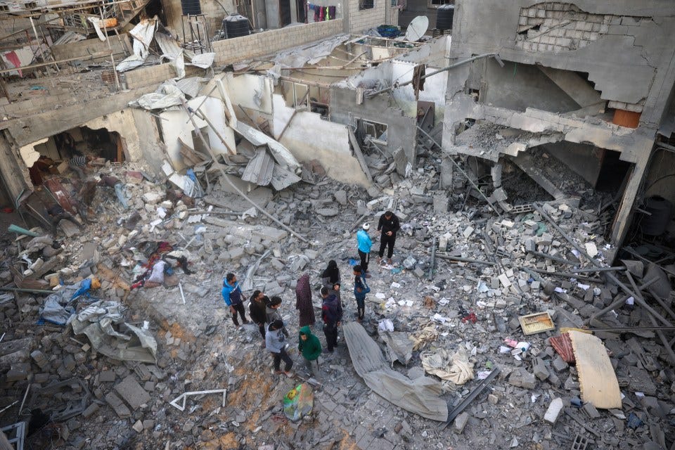 Residents surveying the rubble of their destroyed homes in Gaza.