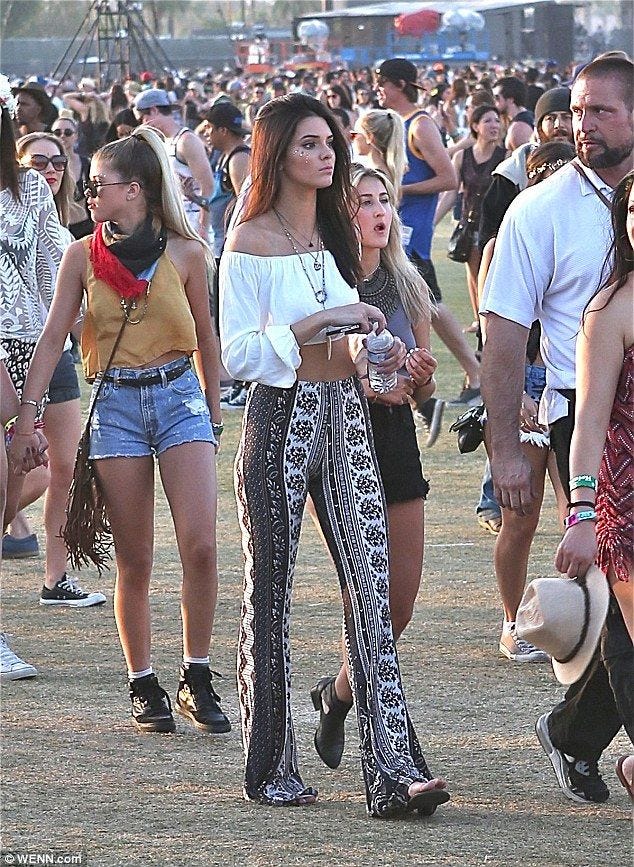 Kendall Jenner Coachella Style. Bell bottom leggings!!! LOVE THIS.