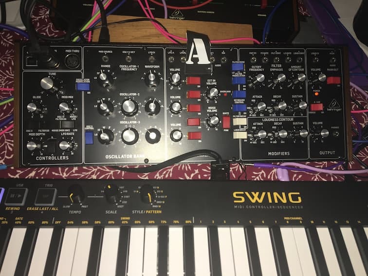 Photo of a Model D synthesizer and a keyboard.