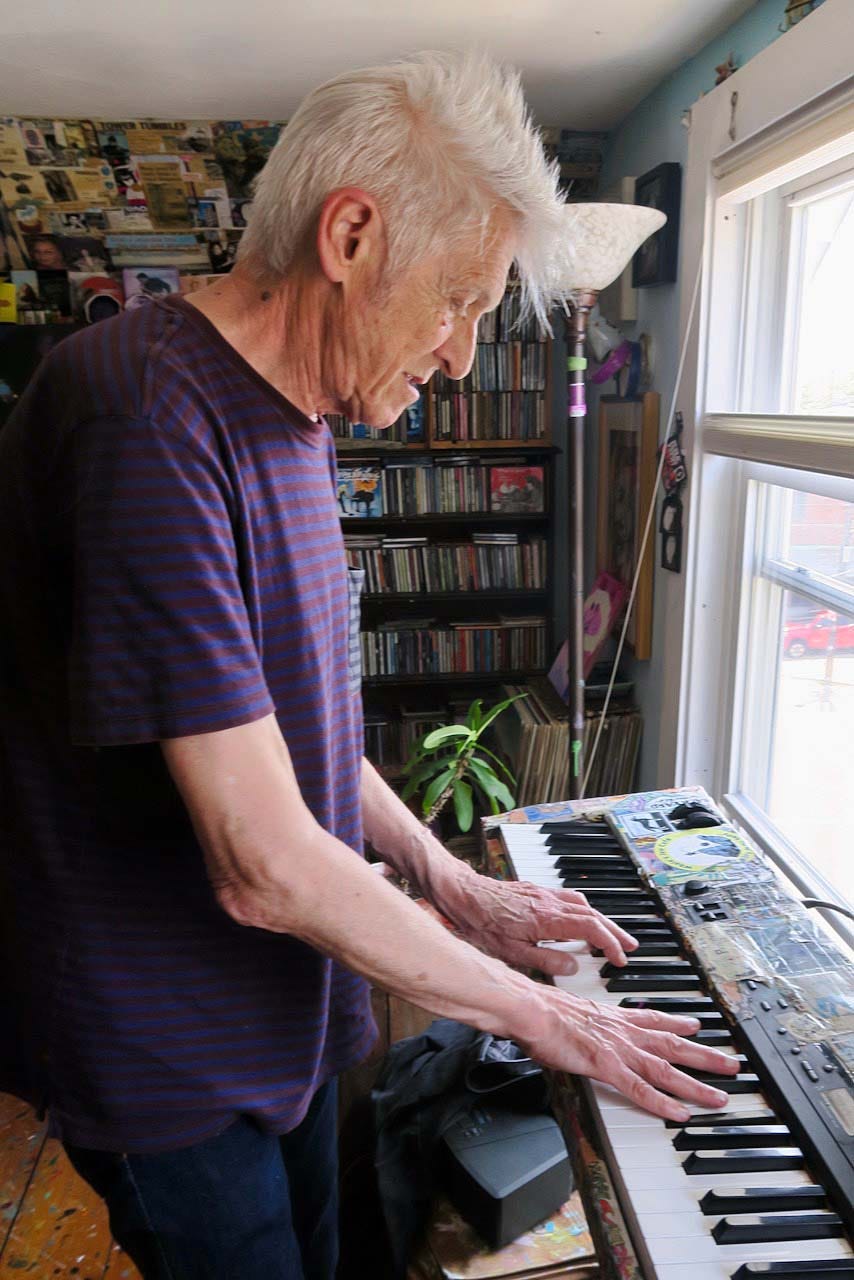 A person playing a piano

Description automatically generated