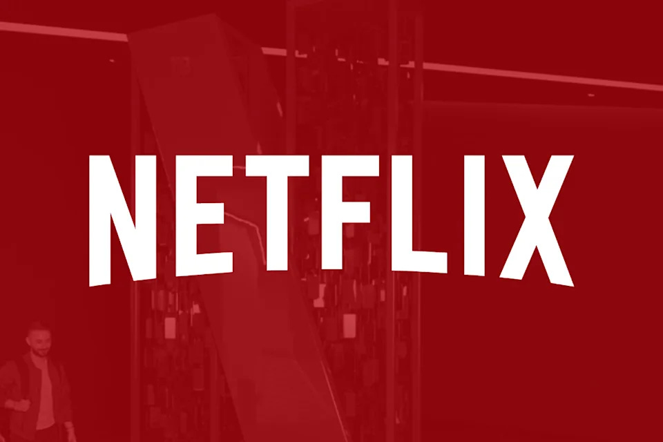 Netflix's logo is superimposed on an office building.