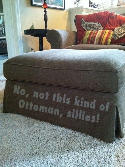 Photo of an ottoman that has the following text written on it: “No, not this kind of Ottoman, sillies!”