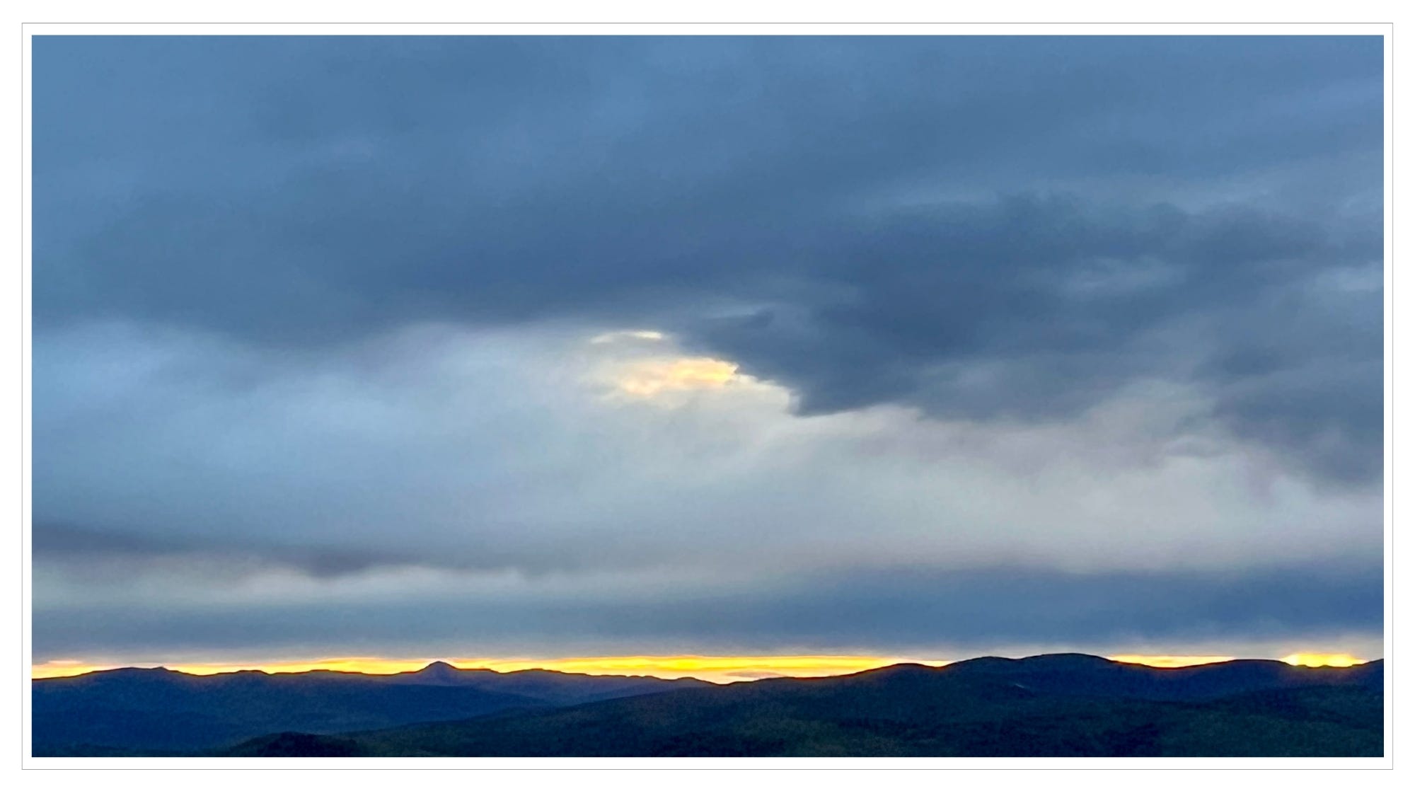 distant mountain horizon, pre-dawn sky, sunlight rising