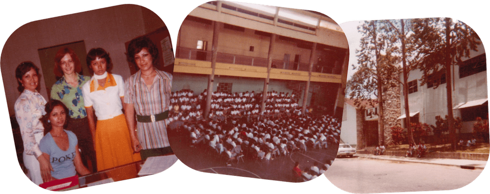 Three old Instamatic photos with rounded corners placed in an informal collage. On the left, a group of young women dressed in tops and skirts gathers behind a desk facing the camera. In the middle is a photo taken from a balcony surrounding a large central floor, where hundreds of students in white shirts are sitting on folding chairs in a student assembly. On the right, the street-facing wall of the school, a white frame and red brick facade with three tall slender trees lining the street. Three old Instamatic photos with rounded corners placed in an informal collage. On the left, a group of young women dressed in tops and skirts gathers behind a desk facing the camera. In the middle is a photo taken from a balcony surrounding a large central floor, where hundreds of students in white shirts are sitting on folding chairs in a student assembly. On the right, the street-facing wall of the school, a white frame and red brick facade with three tall slender trees lining the street.