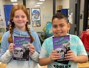Kids holding books