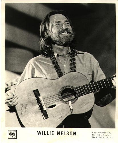 A person holding a guitar
AI-generated content may be incorrect. Willie Nelson Columbia records image, public domain