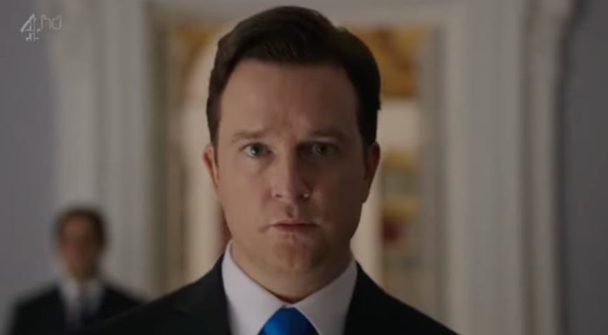 A person in a suit and tie

AI-generated content may be incorrect.