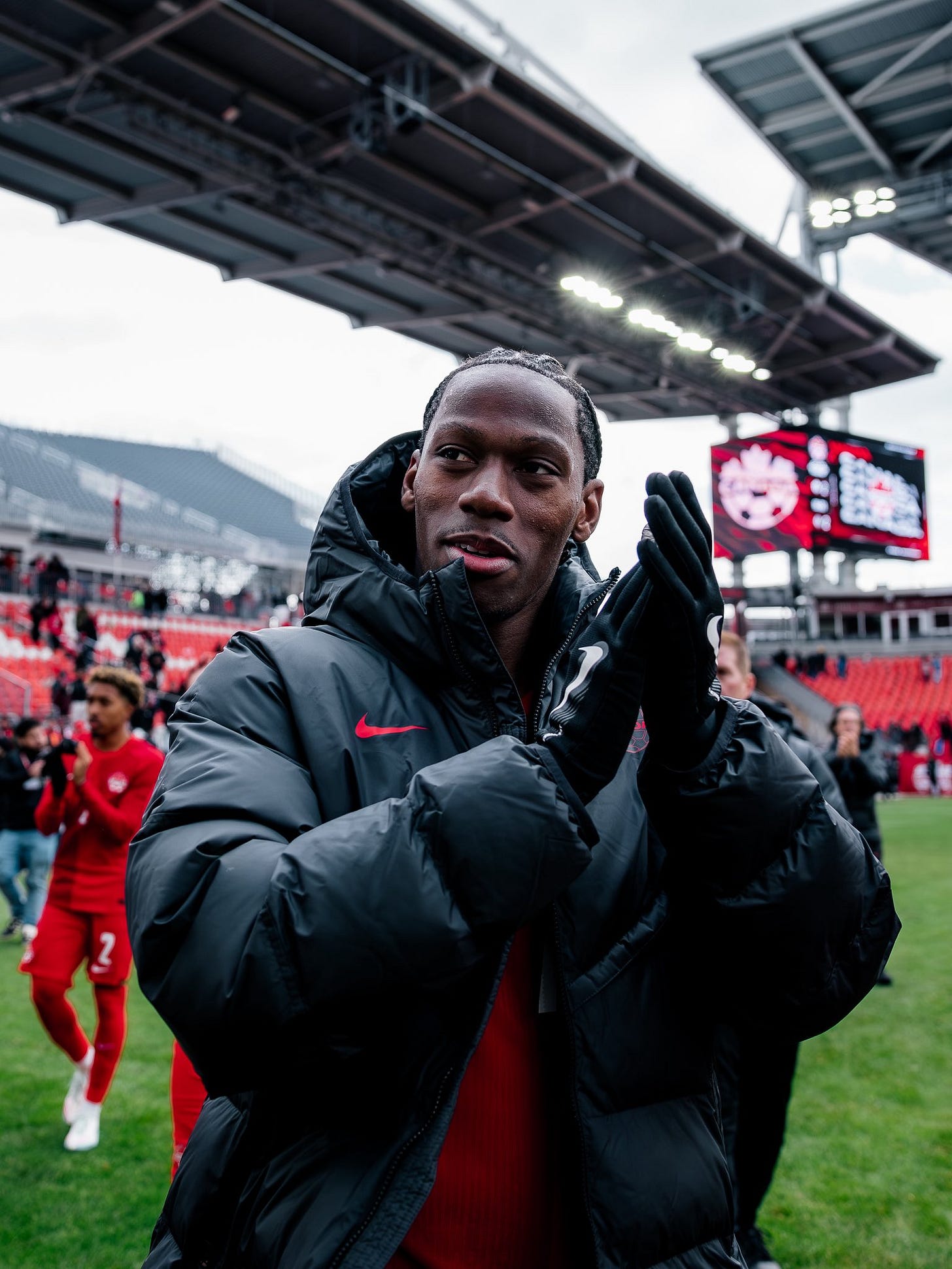 Jonathan David applauds the crowd after the 2-2 draw with Iceland