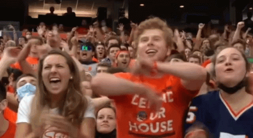 a man in an orange shirt that says " let 's our house " a man in an orange shirt that says " let 's our house "