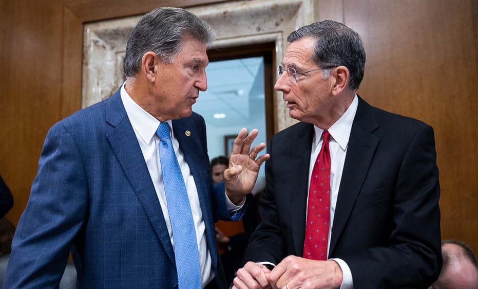 Sens. Joe Manchin (D-W.Va.) and John Barrasso (R-Wyo.). Sens. Joe Manchin (D-W.Va.) and John Barrasso (R-Wyo.).