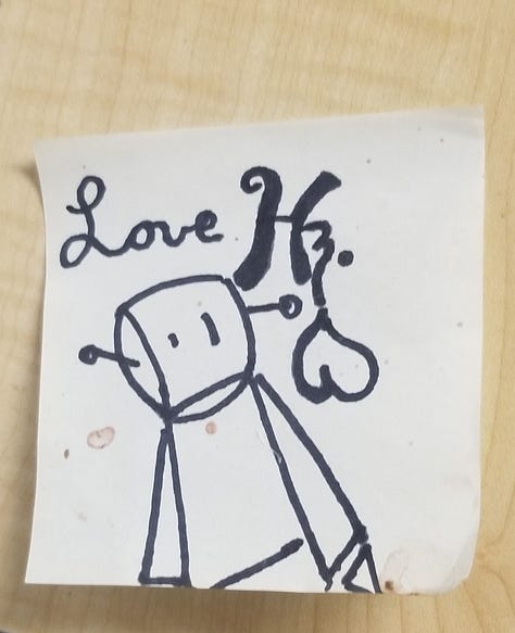 a cartoon robot drawn and painted on many surfaces.