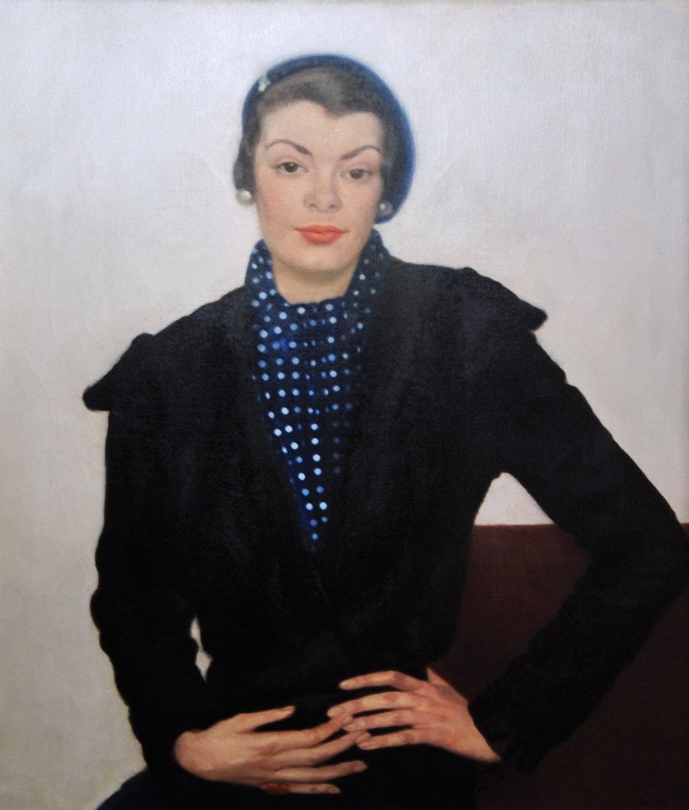 Painting of a woman in a blue polka dot scarf and black blazer, wearing a blue beret. She gazes confidently with her hands on her lap. She has thin eyebrows, and coral lips, and she is looking straight at the viewer. She is sitting on a brown couch, with a white background behind her. She has short grey hair under the hat, and 2 large stud earrings. Painting of a woman in a blue polka dot scarf and black blazer, wearing a blue beret. She gazes confidently with her hands on her lap. She has thin eyebrows, and coral lips, and she is looking straight at the viewer. She is sitting on a brown couch, with a white background behind her. She has short grey hair under the hat, and 2 large stud earrings.