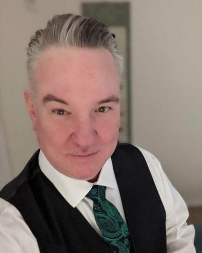 Picture of a handsome man with beautiful hair named Brian Cason Pence. 