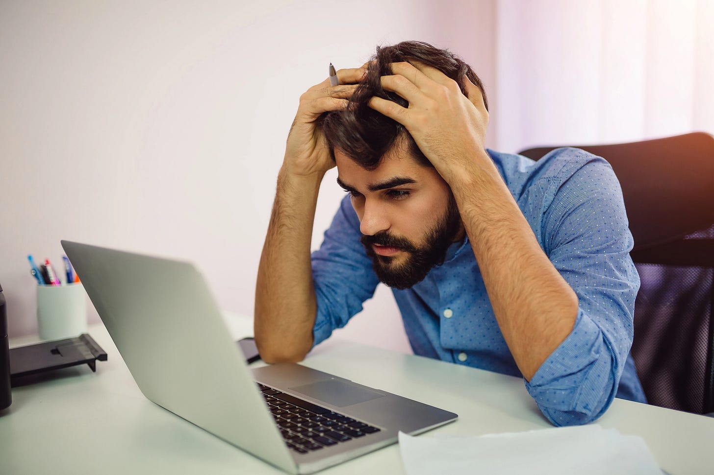 Man staring at laptop screen