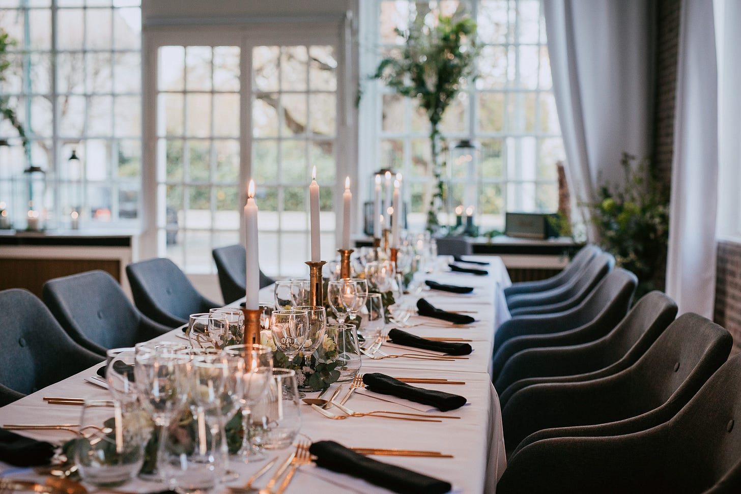 A long table set for a wedding dinner A long table set for a wedding dinner