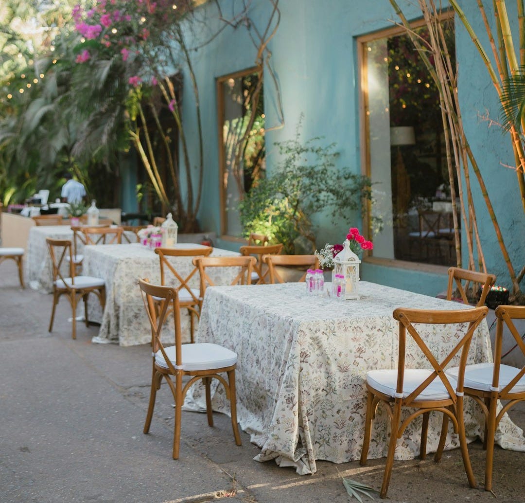 An outdoor dining area with tables and chairs