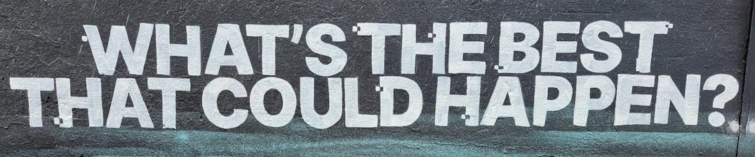 a wall with a message painted on it that says, what's the best