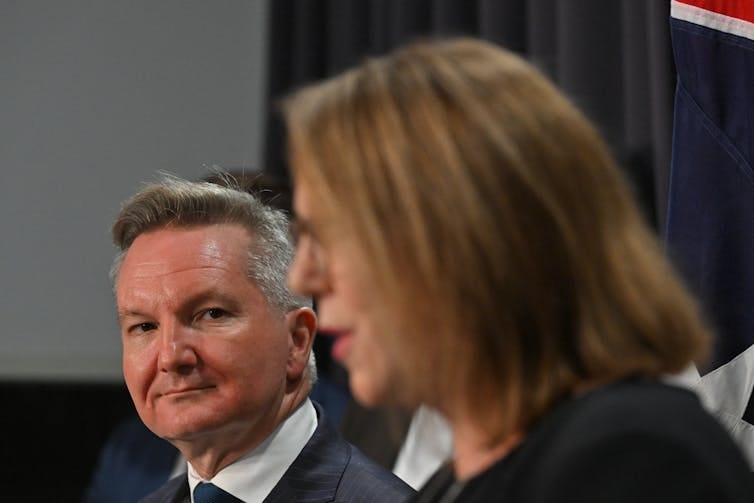 Man looks at woman speaking Man looks at woman speaking