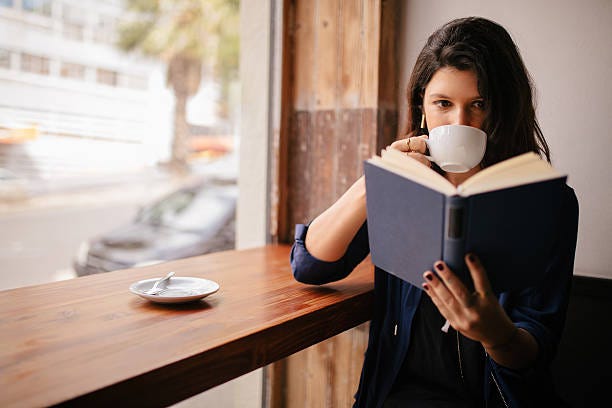 Girl Drinking Coffee And Reading Book In Cafe Stock Photo - Download Image Now - Book, Reading, Coffee - Drink - iStock Girl Drinking Coffee And Reading Book In Cafe Stock Photo - Download Image Now - Book, Reading, Coffee - Drink - iStock