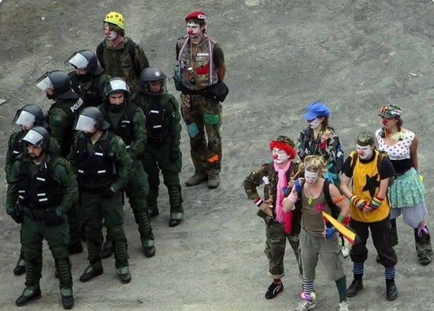 A group of people with face paint standing in a line

AI-generated content may be incorrect.