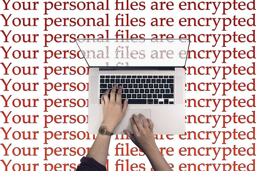 Image of a ransomware and a laptop