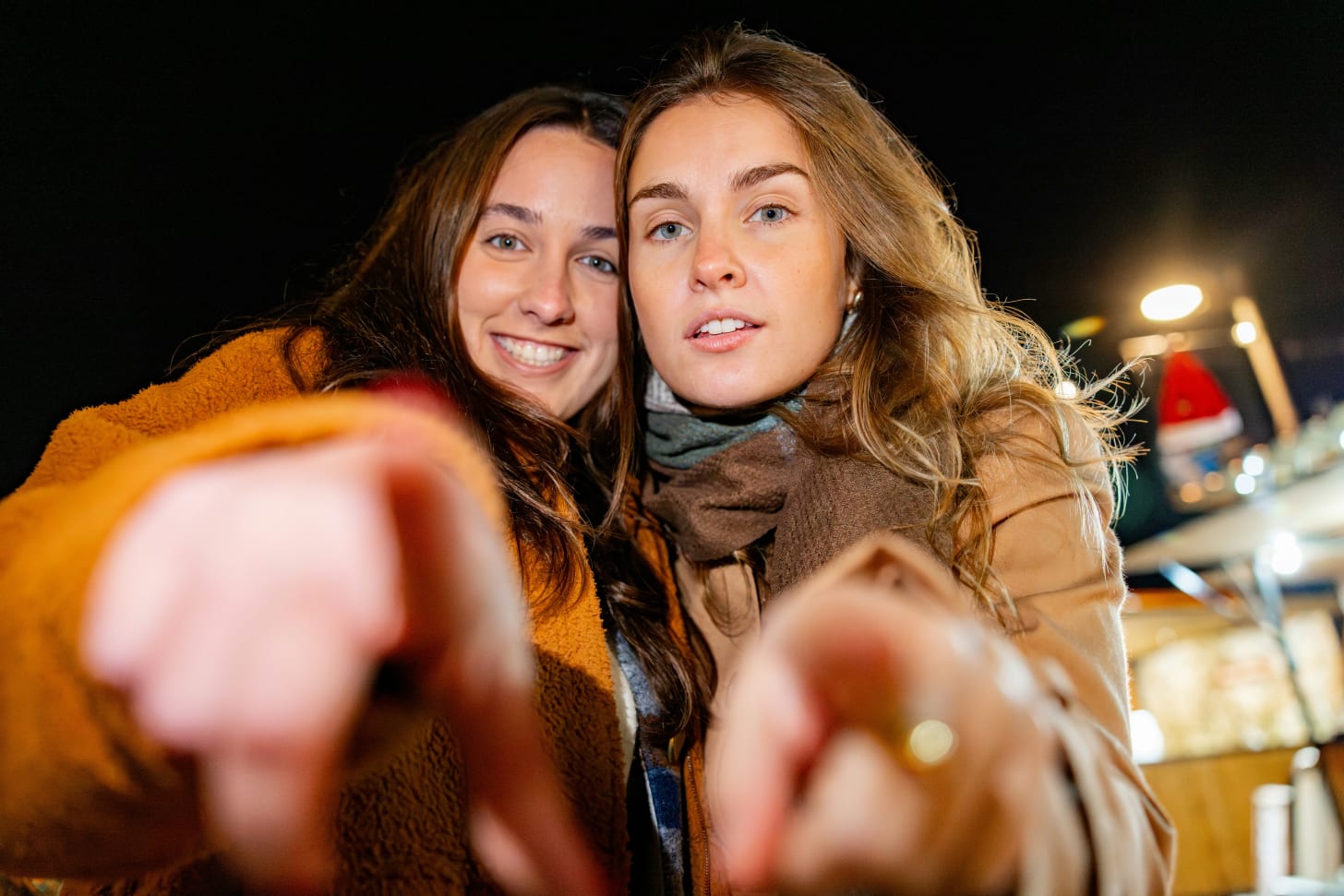 two woman looking into the camera