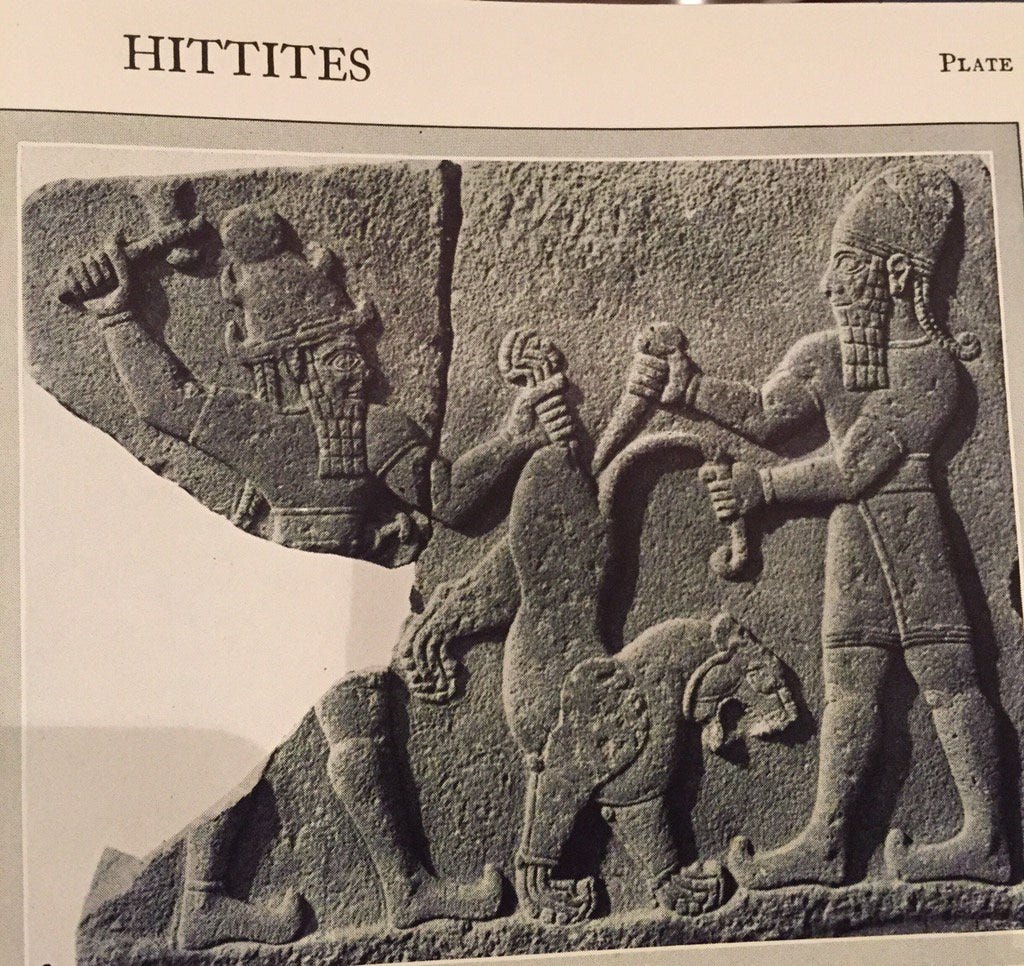 A reproduction in a book, under the title 'HITTITES'  of an ancient stone relief. Two figures are fighting a lion. I'll be frank with you, Visually Impared Squadron, this isn't as funny if you have to spell it out, but between you and me, it rather looks as if they are inserting ice-cream cones into the animal's bottom. I'm so sorry you had to hear that. 