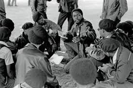 Free Huey" rally, DeFremery Park 1968. Group study of Mao's Little Red Book  - The Bob Fitch Photography Archive - Spotlight at Stanford