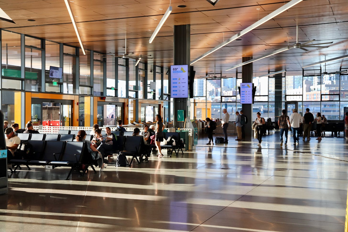 view of seattle terminal waiting room with sun streaming in