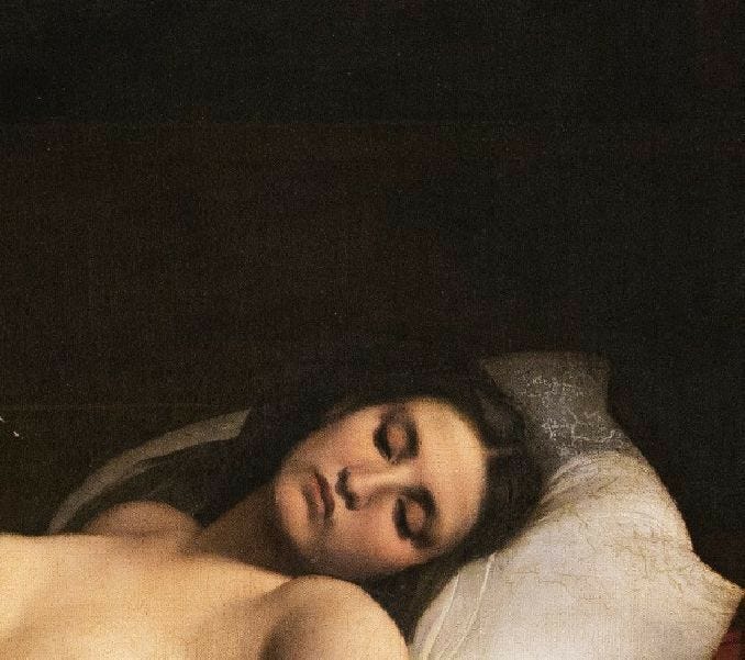 This may contain: a naked woman laying on top of a bed next to a red pillow and blanket