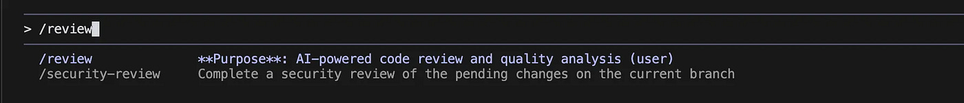 Dark-themed Claude Code interface showing a command palette with ‘/review’ for AI-powered code review and ‘/security-review’ to run a security review of pending changes, captioned ‘Review agent in Claude Code.’