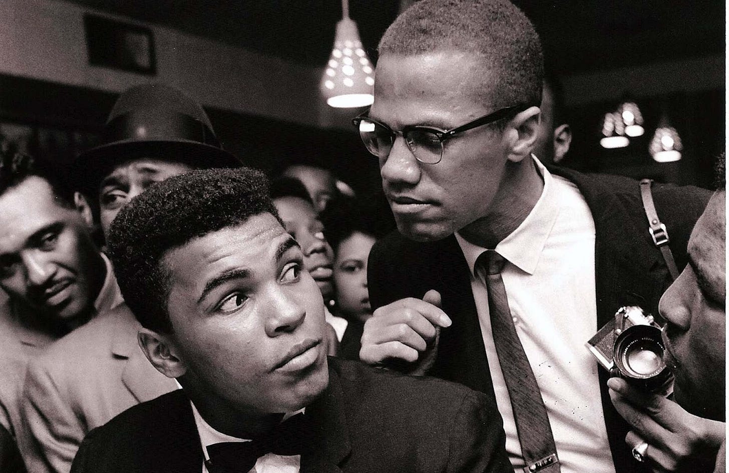 Malcolm X kidding around with Muhammad Ali, New York, 1963.