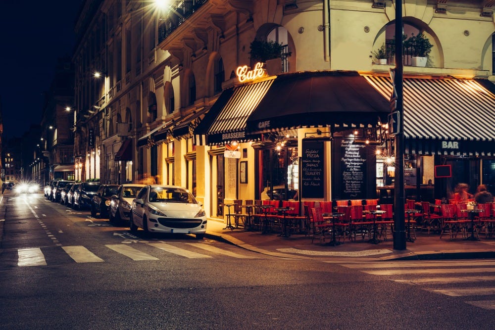 May be an image of 2 people, lighting, road and street