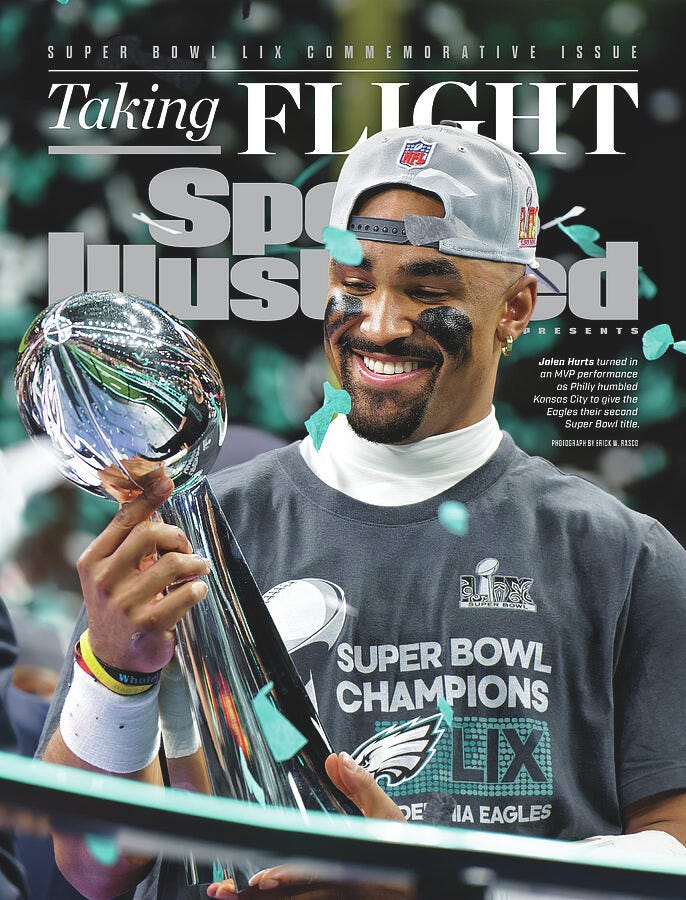 The cover of sports illustrated showing Jalen Hurts holding the Lombardi trophy
