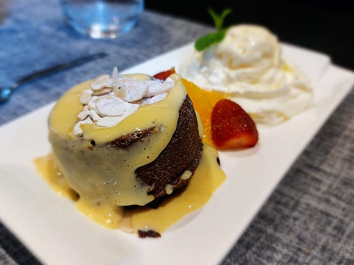 photos of a soup, a main entre, a serving of pasta, and some dessert