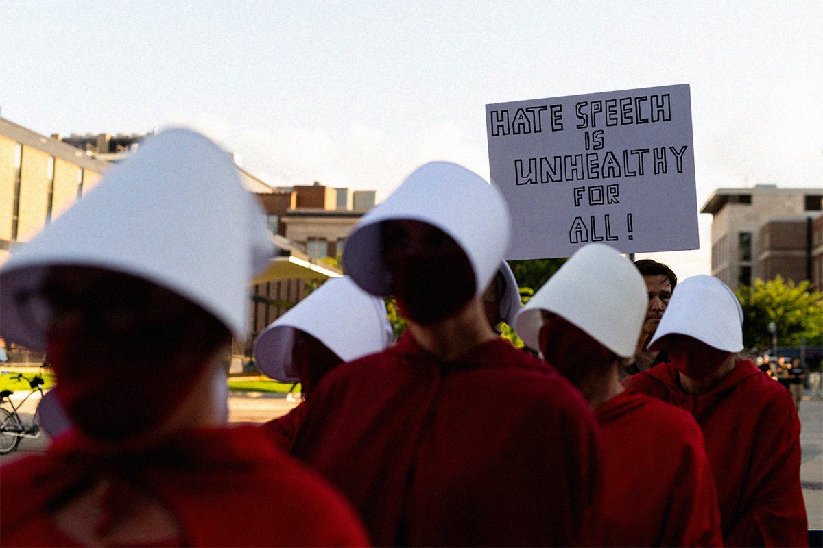 People dressed like handmaids from 'The Handmaid's Tale' protest outside the "American Comeback Tour" event at Northrop Auditorium on the University of Minnesota campus on September 22, 2025 in Minneapolis, Minnesota. People dressed like handmaids from 'The Handmaid's Tale' protest outside the "American Comeback Tour" event at Northrop Auditorium on the University of Minnesota campus on September 22, 2025 in Minneapolis, Minnesota.
