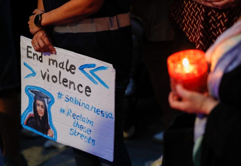 A person holds a placard during a vigil for Sabina Nessa A person holds a placard during a vigil for Sabina Nessa