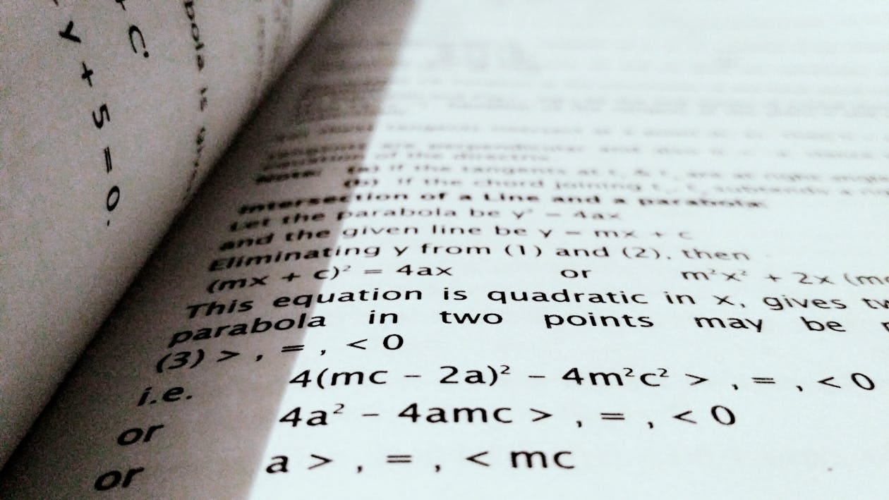 Free A close-up shot of mathematical equations on a book page, perfect for education and learning concepts. Stock Photo Free A close-up shot of mathematical equations on a book page, perfect for education and learning concepts. Stock Photo
