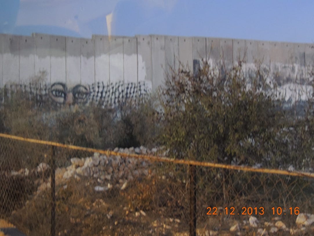 A fenced in area with a wall painted on
Description automatically generated A fenced in area with a wall painted on
Description automatically generated