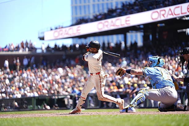 Luis Arraez of the San Francisco Giants hits an RBI single at Oracle Park on July 29, 2026 in San Francisco, California.