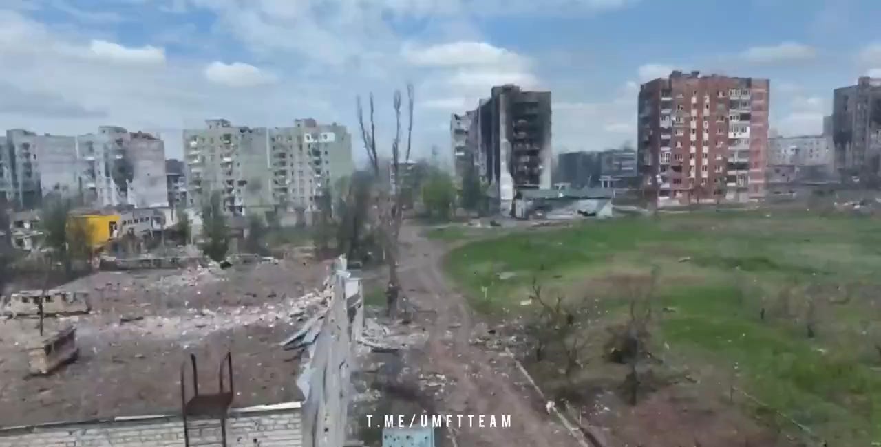 Russian artillery taking apart buildings used as fortified positions by Ukrainian forces at the strongpoint nicknamed "Domino"