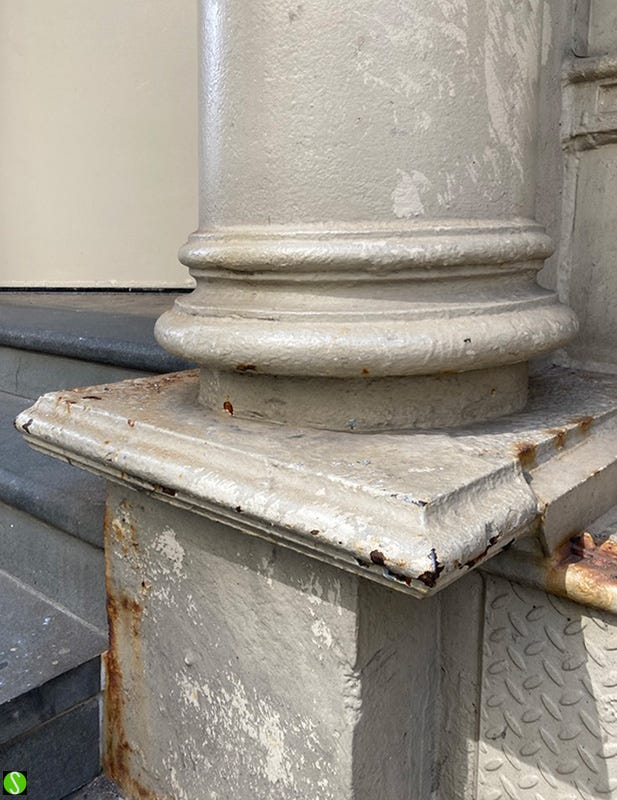 photo by Steve Butcher of rusty cast iron column on building in SoHo, New York