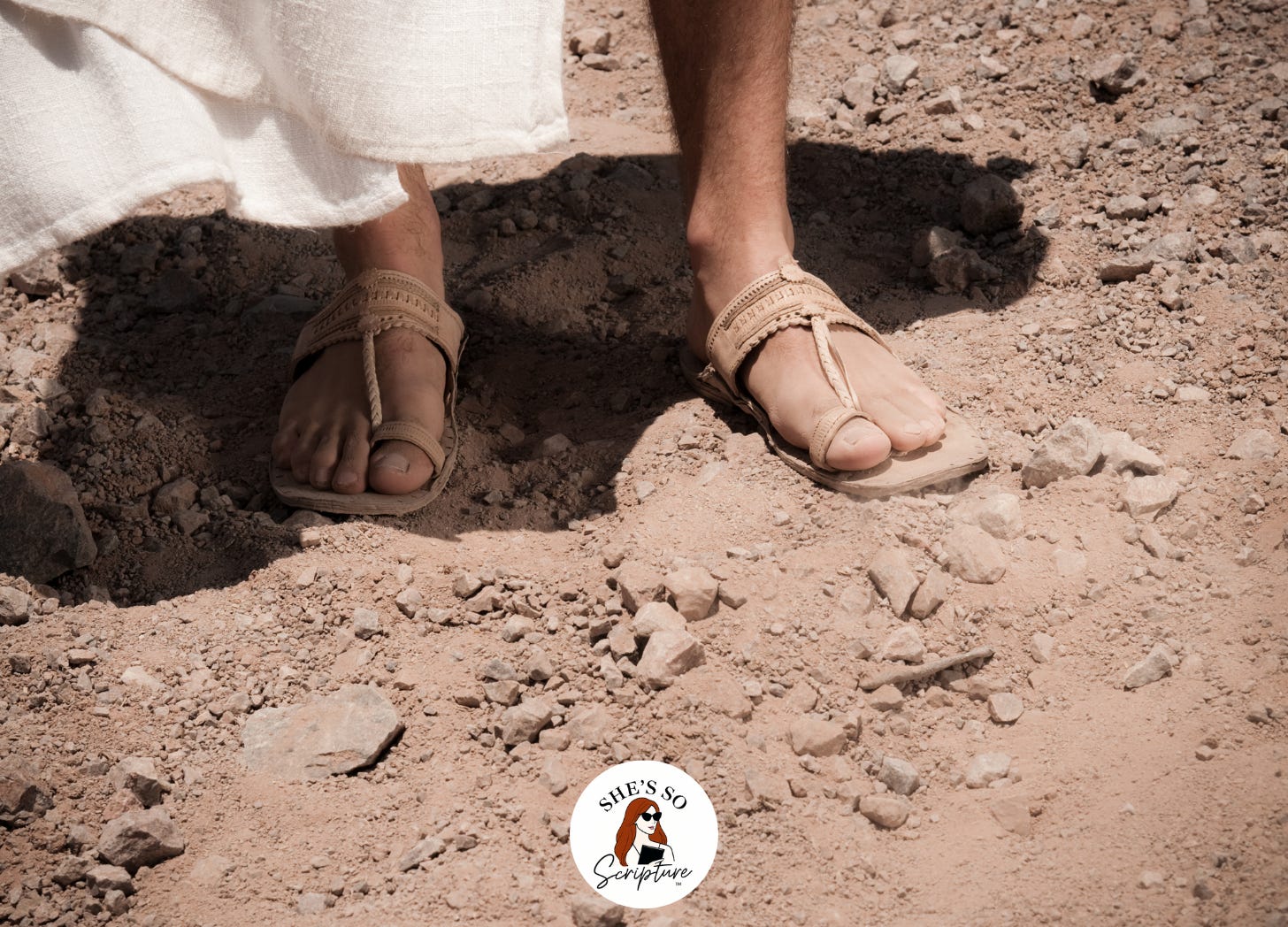 sandaled feet walking in the dirt