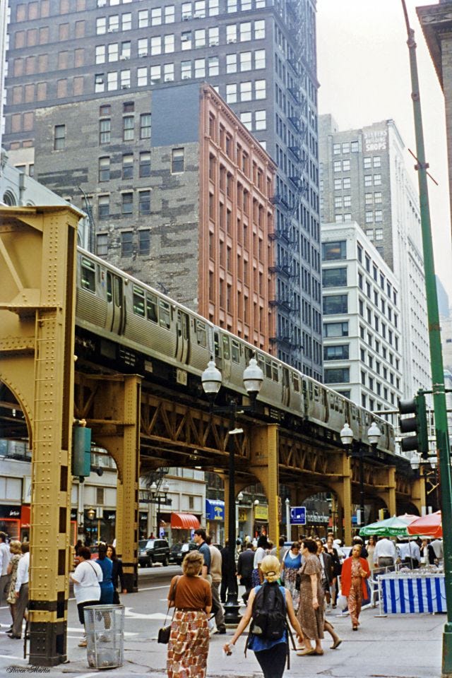 Wabash Avenue looking north from Monroe Street, capturing the vibrant heart of the Chicago Loop, July 1996. Wabash Avenue looking north from Monroe Street, capturing the vibrant heart of the Chicago Loop, July 1996.