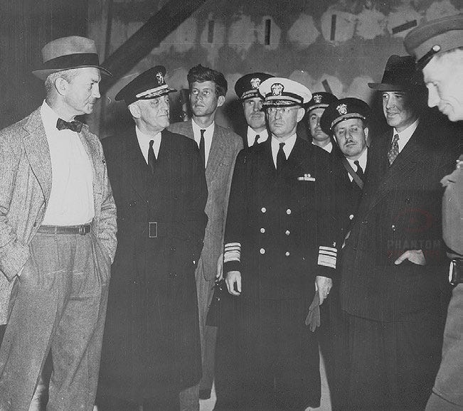 JFK viewing Hitler’s ravaged bunker in 1945. The visit placed him inside the physical remains of the Nazi command world only weeks after the collapse of the Third Reich.
