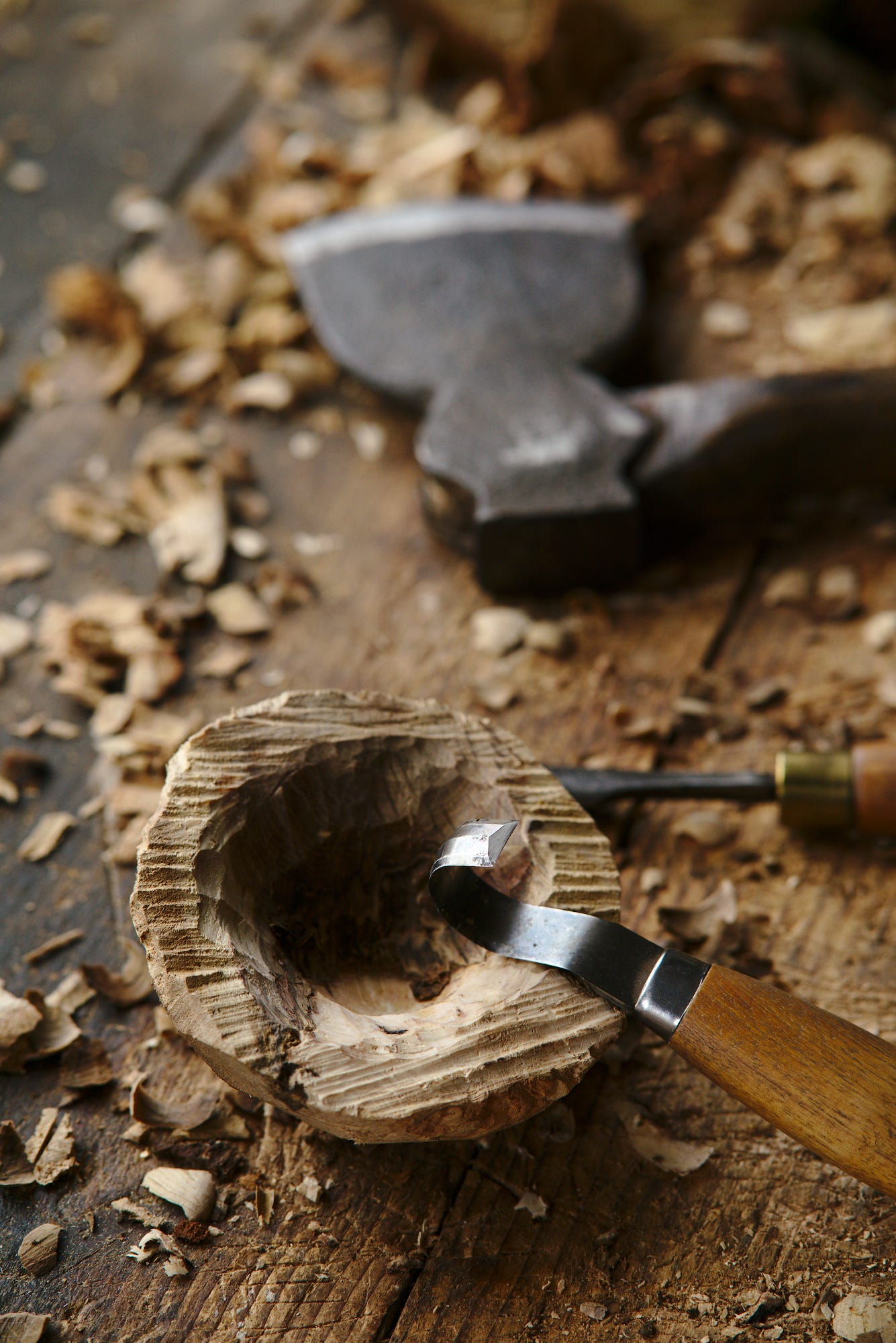 The quaich still in a very rough state, with the beginnings of a large carved bowl and my hook knife resting on the edge of it.