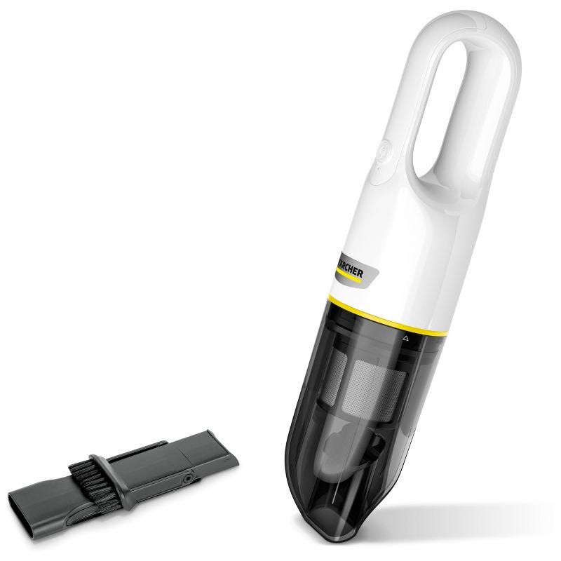 A white and black colored handheld vacuum cleaner with a detachable brush attachment placed beside it.