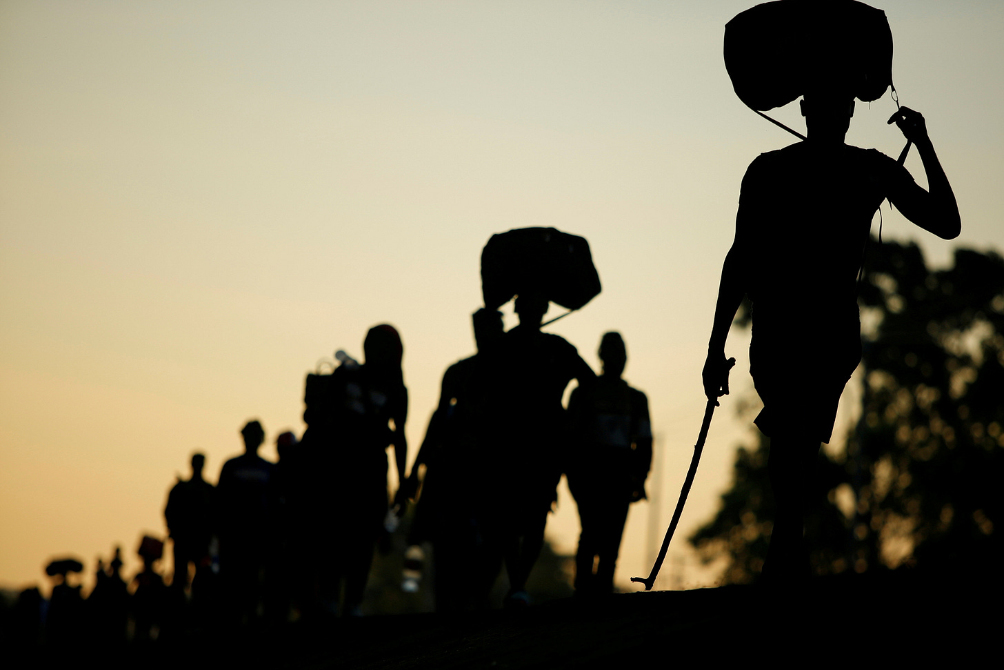 Migrants take part in a caravan heading to the U.S. border, near Huixtla