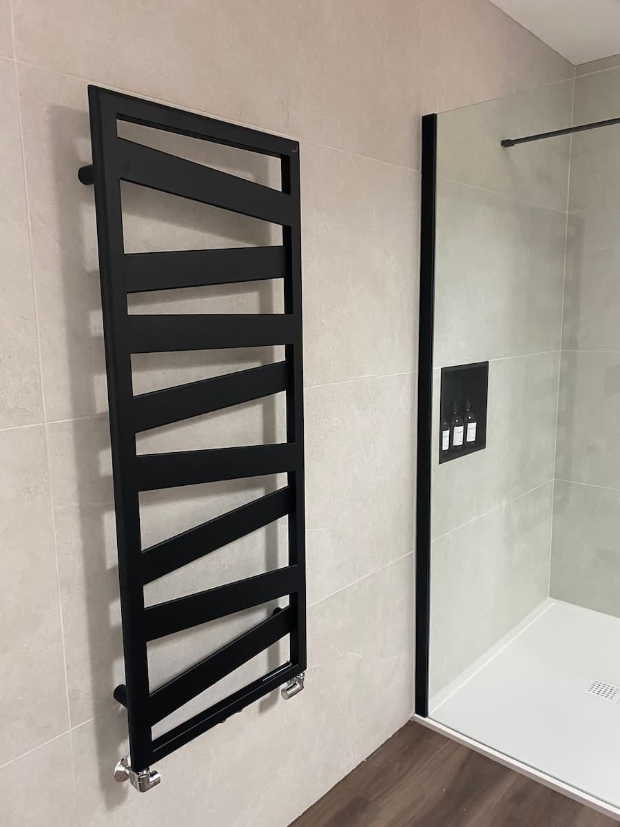 black radiator with wide angled bars making up a pattern